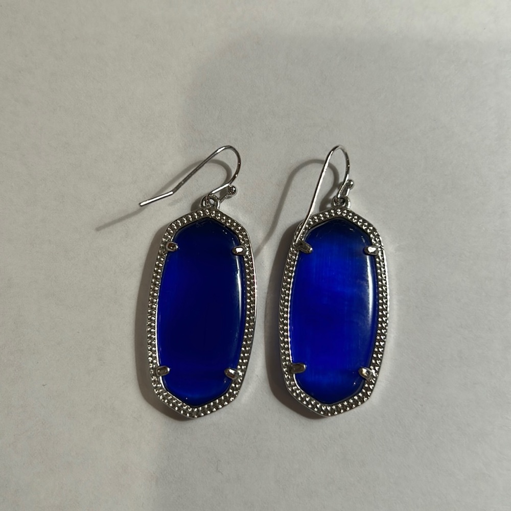 Silver and blue Kendra Scott earrings.